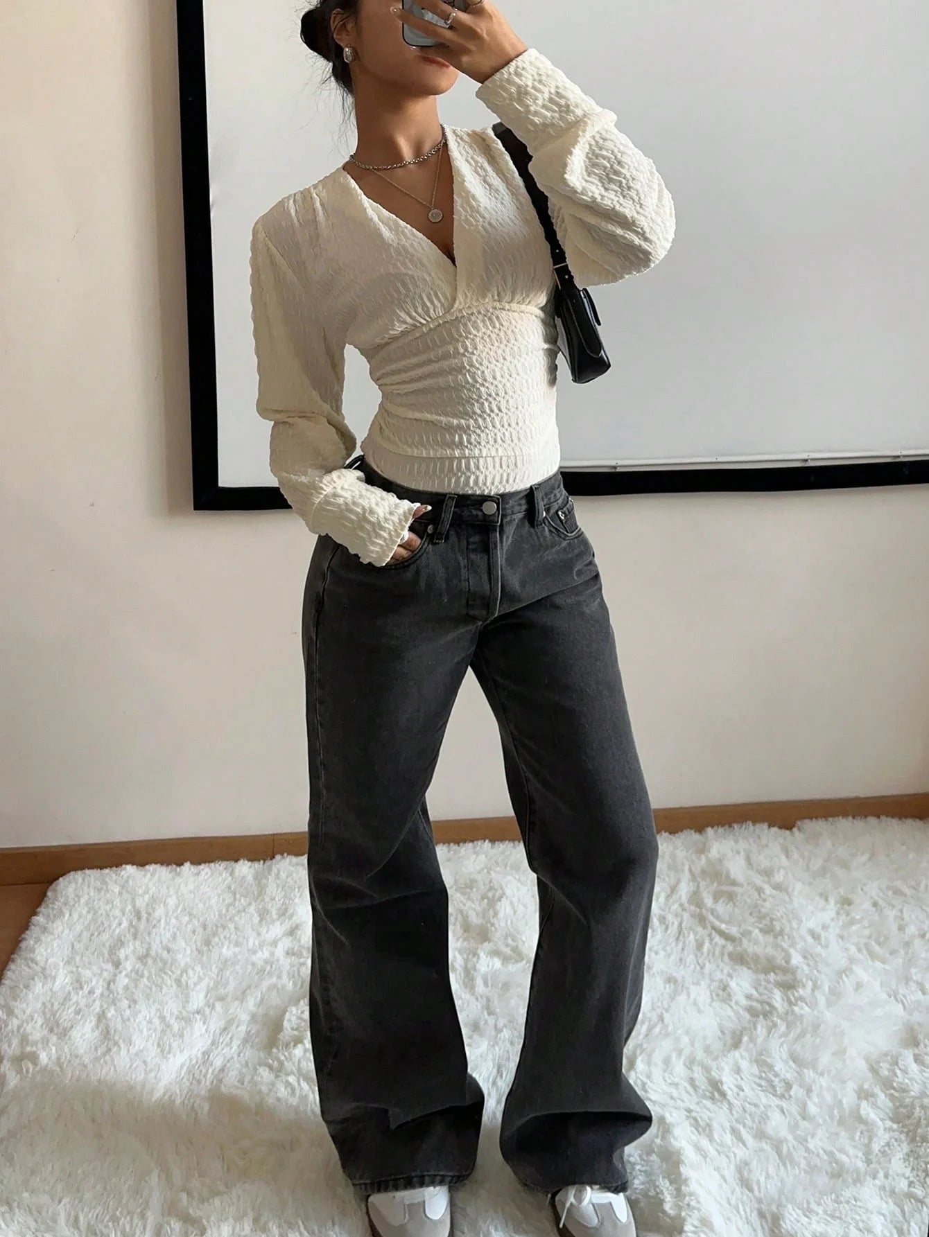 A tight long-sleeved knitted jumpsuit with a small V-neck for women